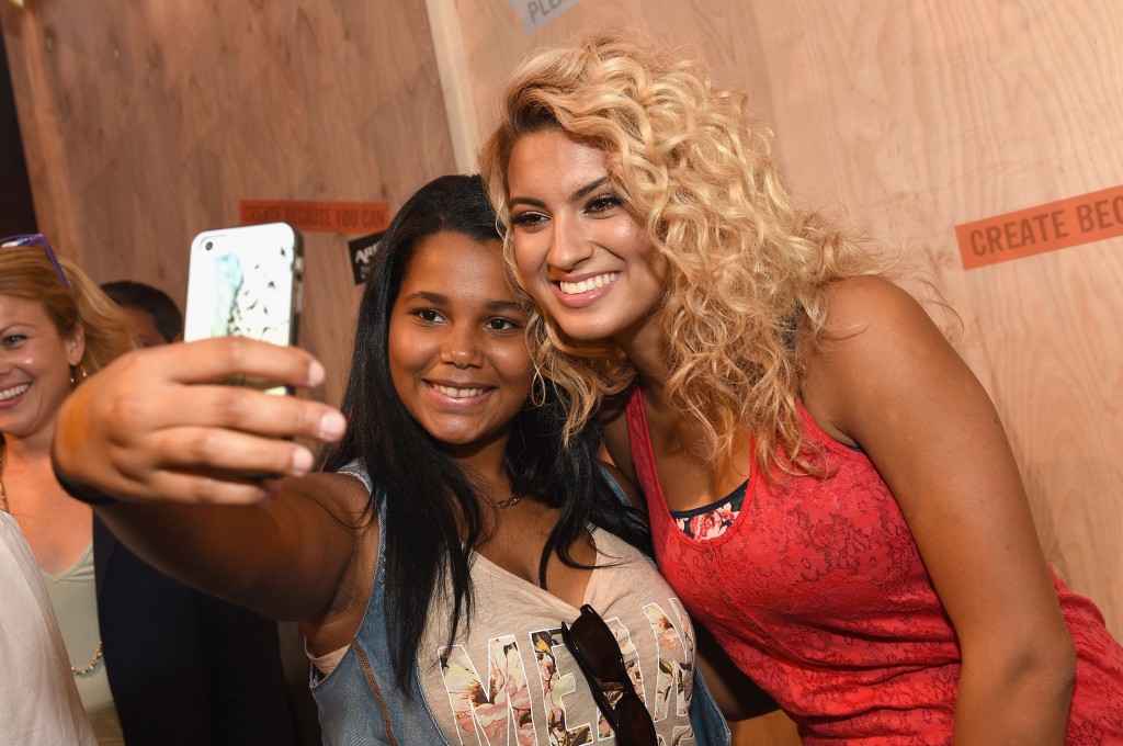 Tori Kelly posing for pics with a Fan ARIZONA JEAN CO Hosts VIP Event In Brooklyn With Tori Kelly And Alex & Sierra