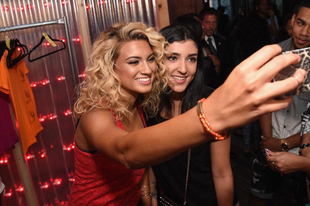 Tori Kelly posing for pics with a Fan ARIZONA JEAN CO Hosts VIP Event In Brooklyn With Tori Kelly And Alex & Sierra